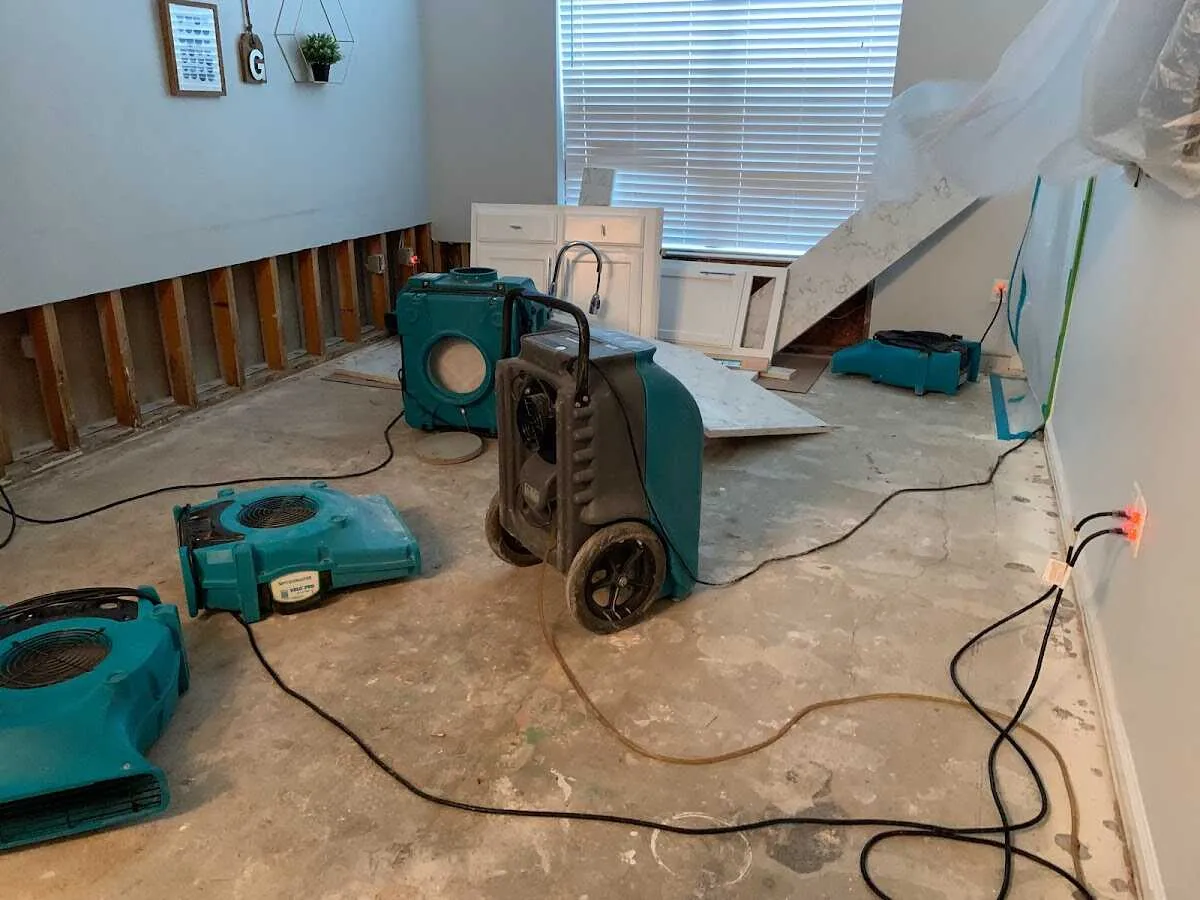 Dehumidifier in flood-cut room for Water Damage Restoration in Berthoud